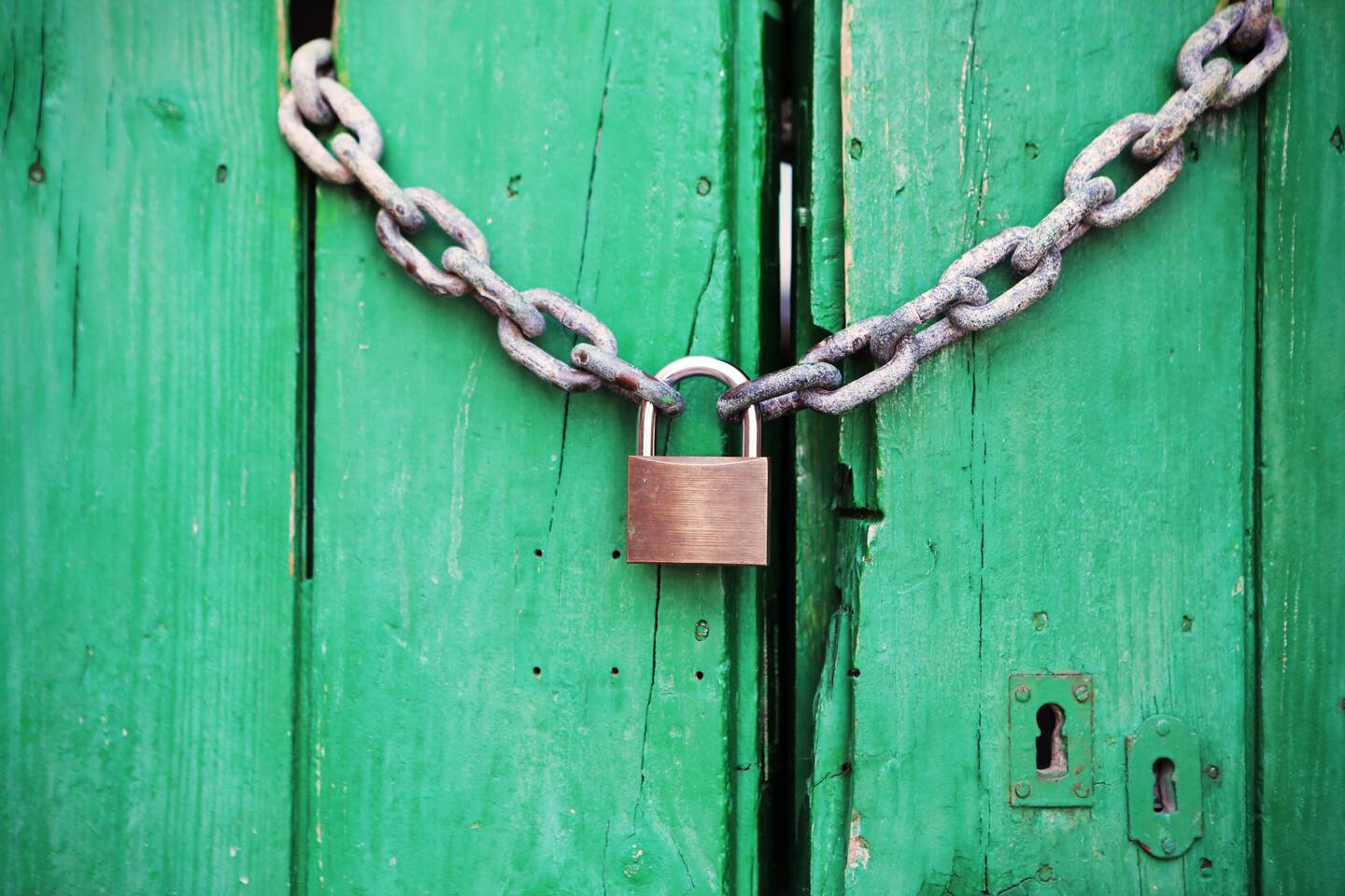 Lock against a green door